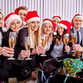 33713562-Happy-business-group-people-in-santa-hat-drinking-champagne-Xmas-Stock-Photo