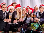 33713562-Happy-business-group-people-in-santa-hat-drinking-champagne-Xmas-Stock-Photo