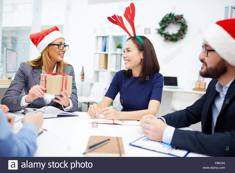cheerful-business-people-having-meeting-on-christmas-F88J44.jpg